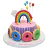 Cake with rainbow and doughnuts